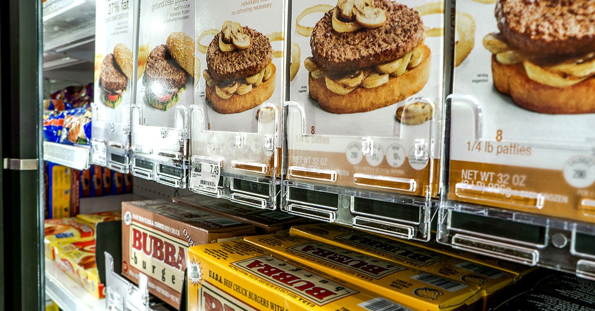Organized food on display at a grocery store using pusher trays
