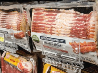 packaged bacon in grocery cooler