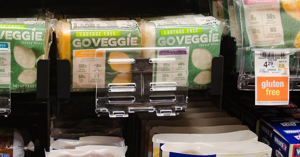 plant-based cheeses at a grocery store in a Retail Space Solutions pusher tray