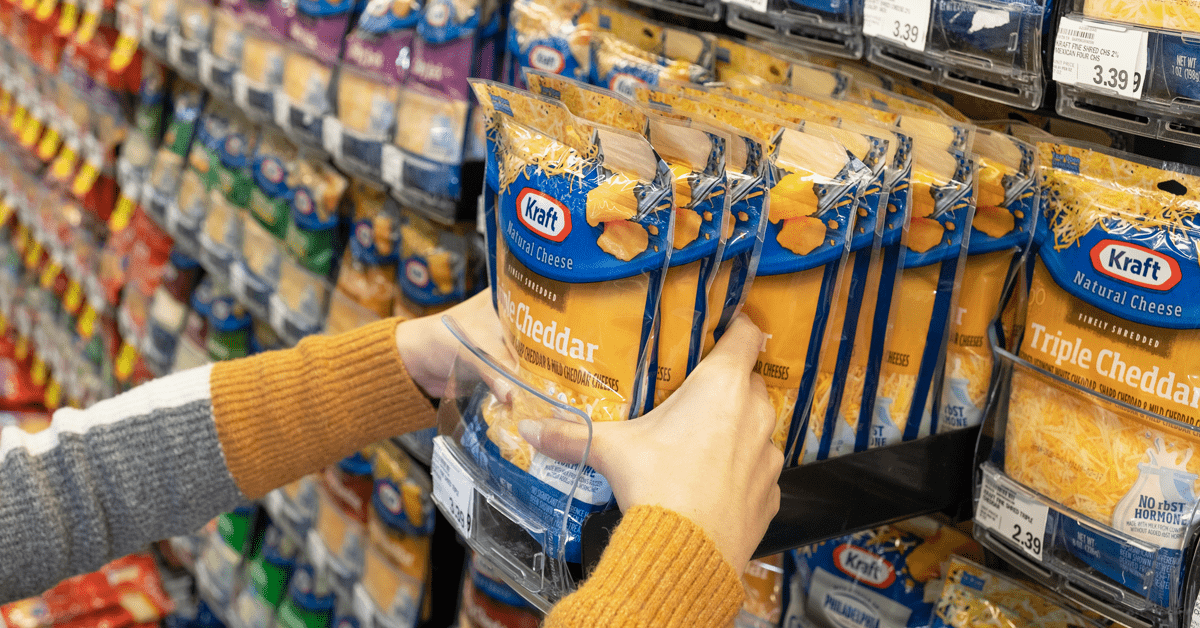 bagged cheese in a pusher tray at a grocery store
